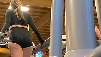 Voyeuristic view of a college student's huge ass in the gym