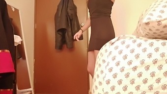 Voyeuristic camera captures young brunette in dressing room