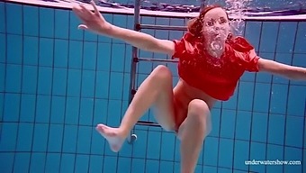 Russian pornstar with big natural tits enjoys solo pool session