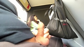 POV video of a brunette giving a handjob in public