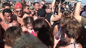 Bikini-clad girls in a wild group sex session on the beach