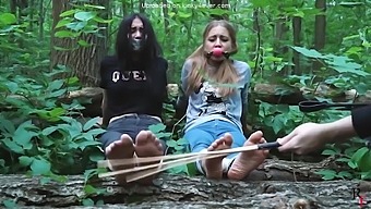 Blonde and brunette BDSM in group sex outdoor