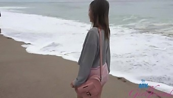 Watch as Macy Meadows shows off her long hair and miniskirt on the beach in this HD POV video