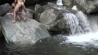Horny teens climb on a rock for outdoor sex