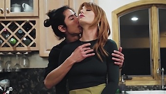 Redhead gets her pussy and tits pinched while taking a pounding from an Asian cock