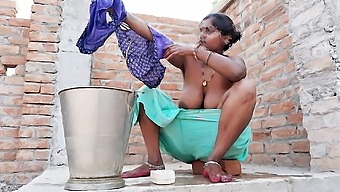 Bathing and fingering fun with an Indian MILF