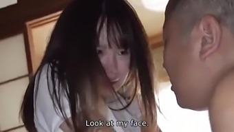 An Asian girl with an old man in a blowjob scene