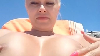 European wife flaunts her curves on the beach