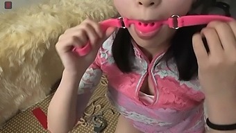 Chinese girl in white stockings and BDSM gear
