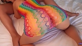 Beautiful LilyKoti gives a blowjob and takes it from a big cock in a rainbow suit