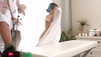 Sensual massage with oils leads to oral sex and pussy play for a young girl with blue hair