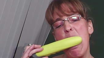 Marie R., a mature amateur, indulges in solo play with toy and glasses