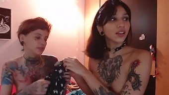 Two sexy inked babes put their skills to the test with their fiery twats